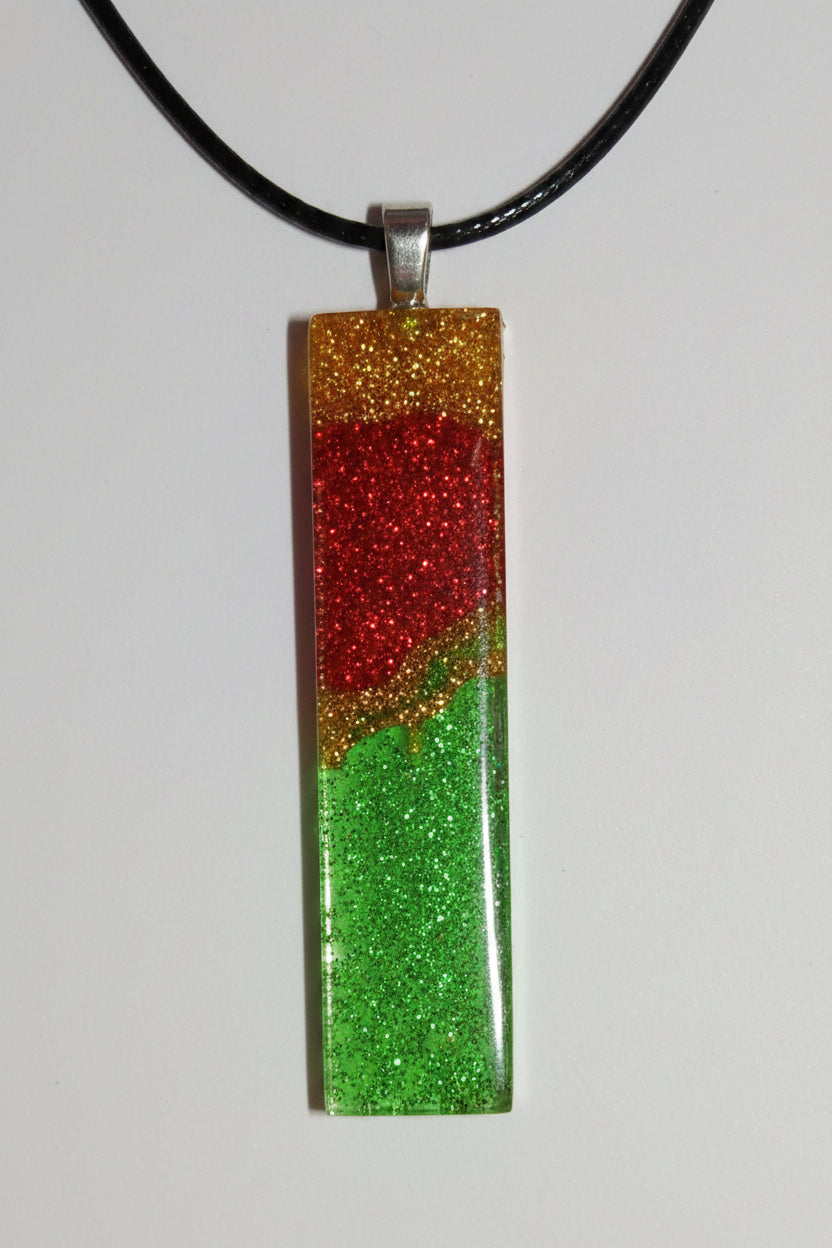 Aura stones- pendulum of red gold and green